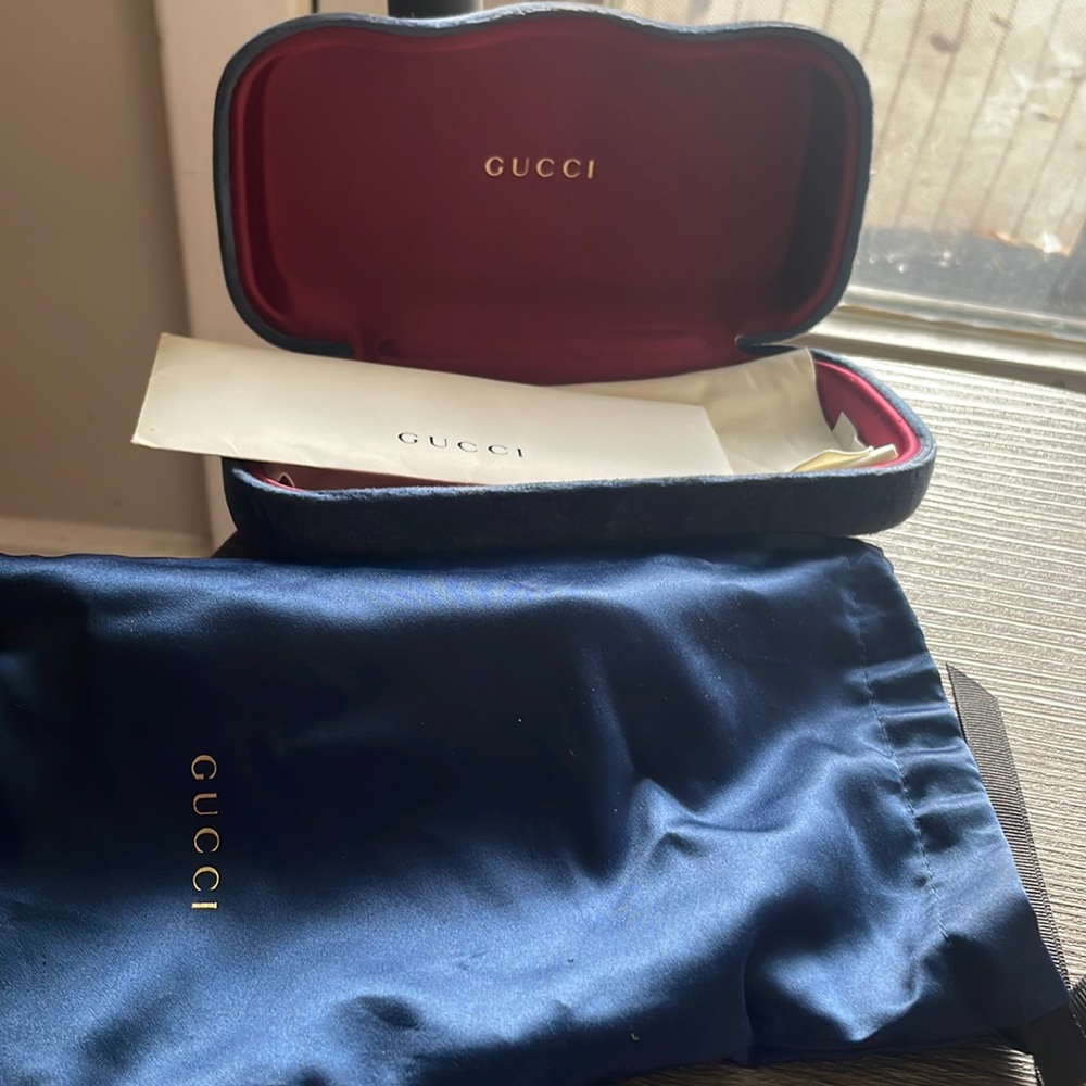 Womens Black and Dark Blue GUCCI shades with red and white strips and Gold GG